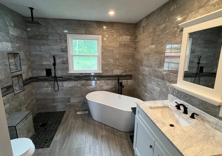 Bathroom with tile shower and freestanding tub